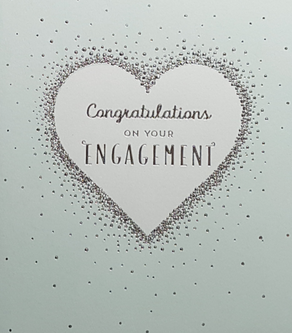 Engagement Card - A Silver Heart On A Pale Green Background