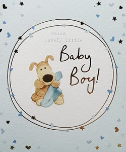 New Baby Card - Boy / Cute Dog Holding Blue Blanket Sitting In A White Circle