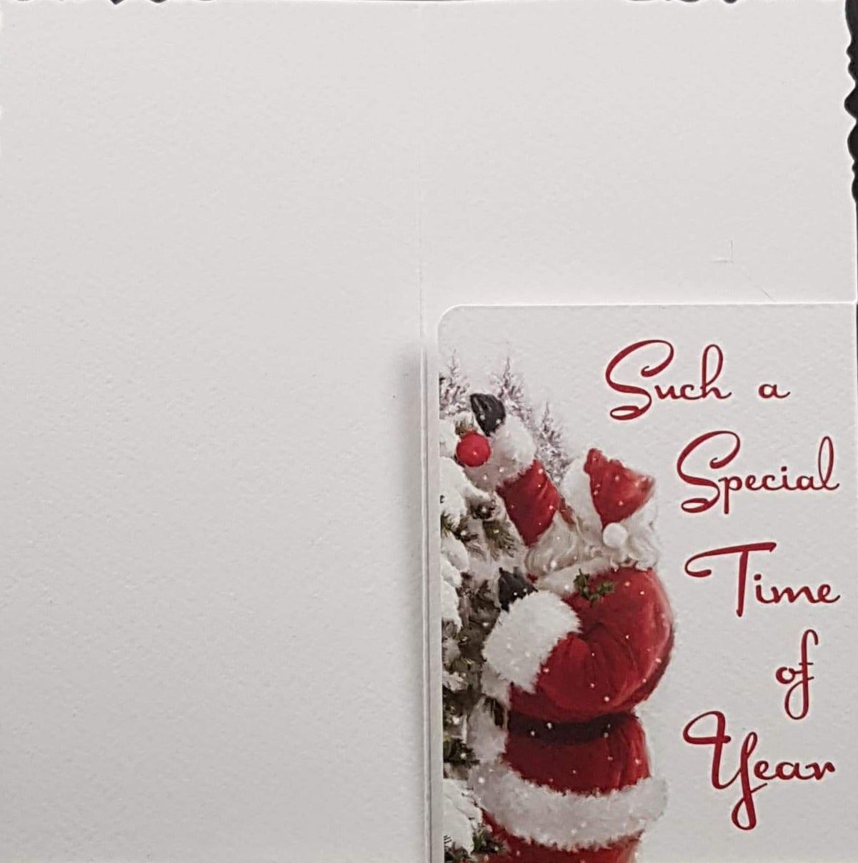 General Christmas Card - A Gift at Christmas & Santa Putting Gifts Under Tree