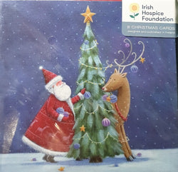 Santa and Reindeer decorating the Christmas Tree