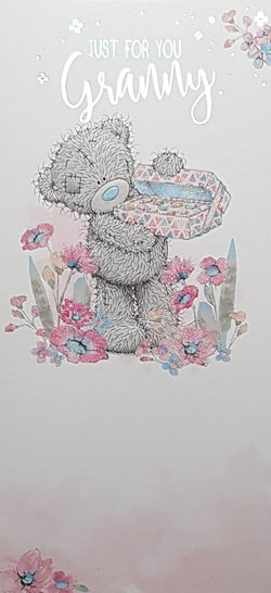 Birthday Card - Granny / Cute Teddy Opening A Pink Box Beside Flowers